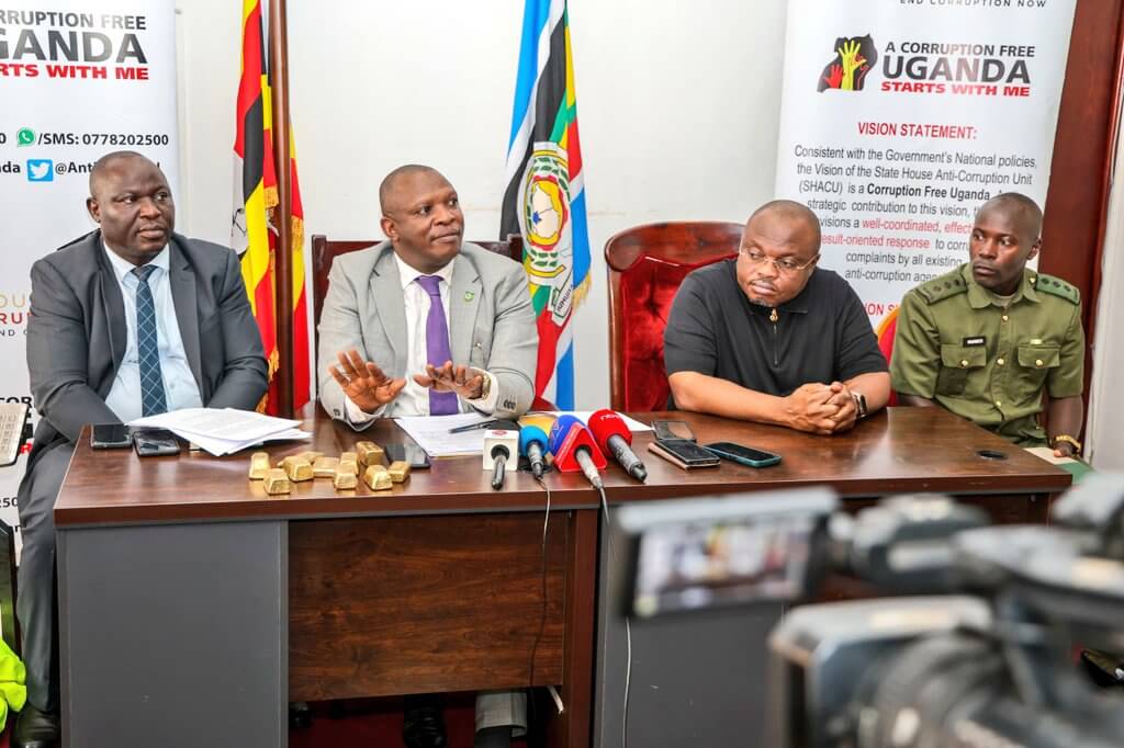 Uganda arrests seven in cross-border gold scam.