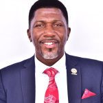 Balimwezo Ronald Nsubuga, Ugandan MP for Nakawa East and Chairperson of Kampala City Roads Committee, in a formal suit